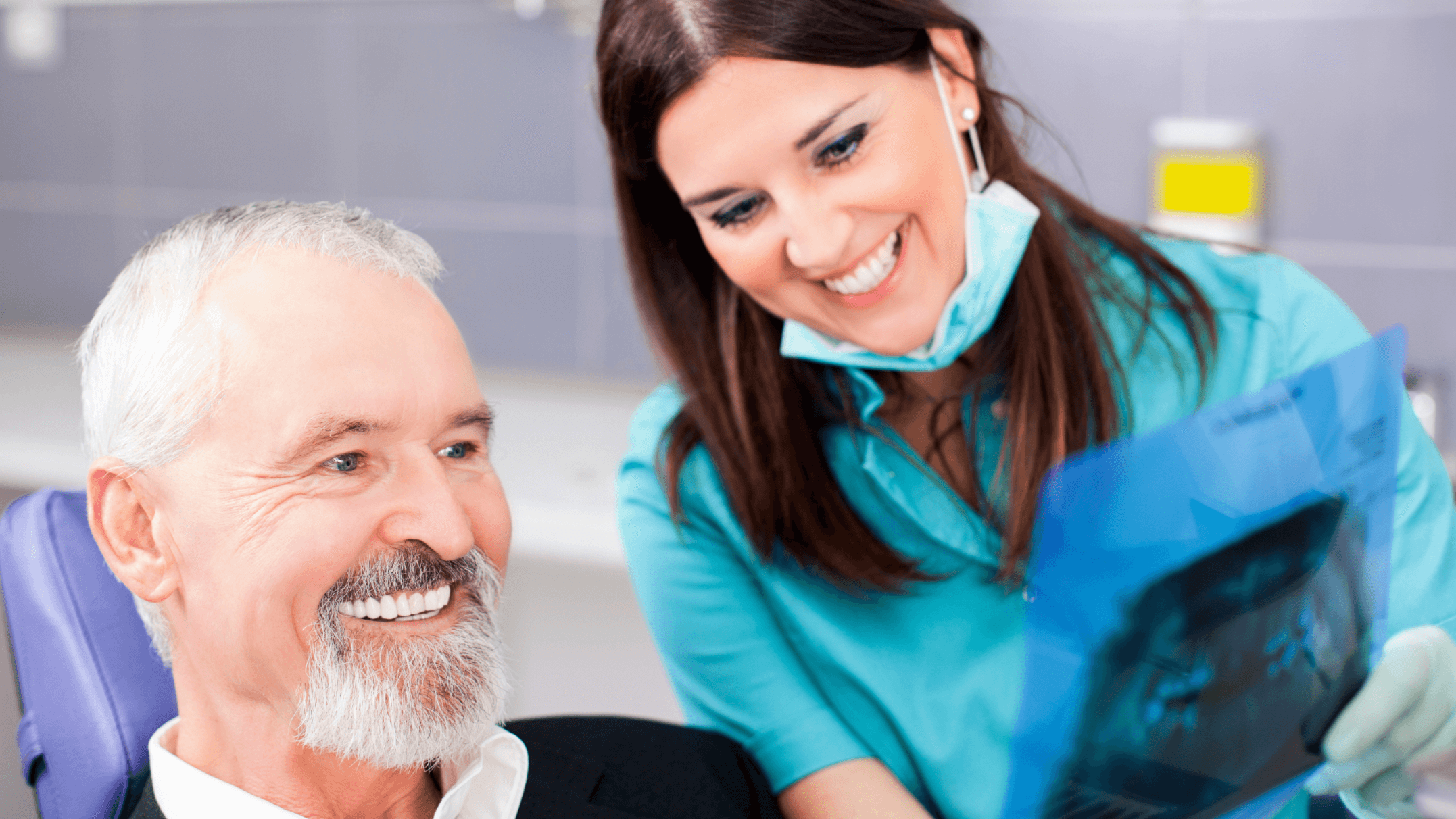 man at dentist smiling